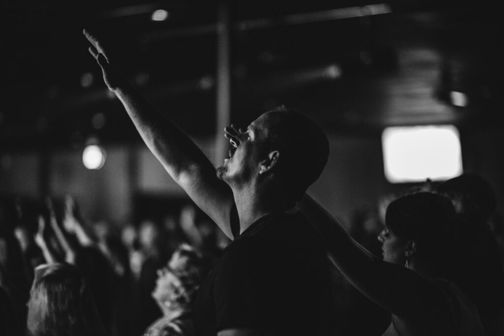 photo of man in praising and worshiping