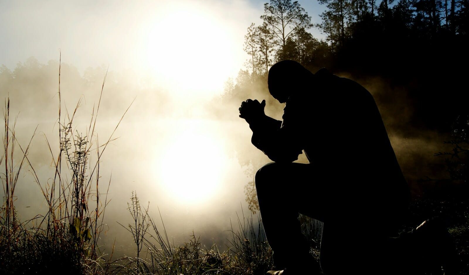 Let God Love You: Rediscovering true Faith silhouette of kneeling man