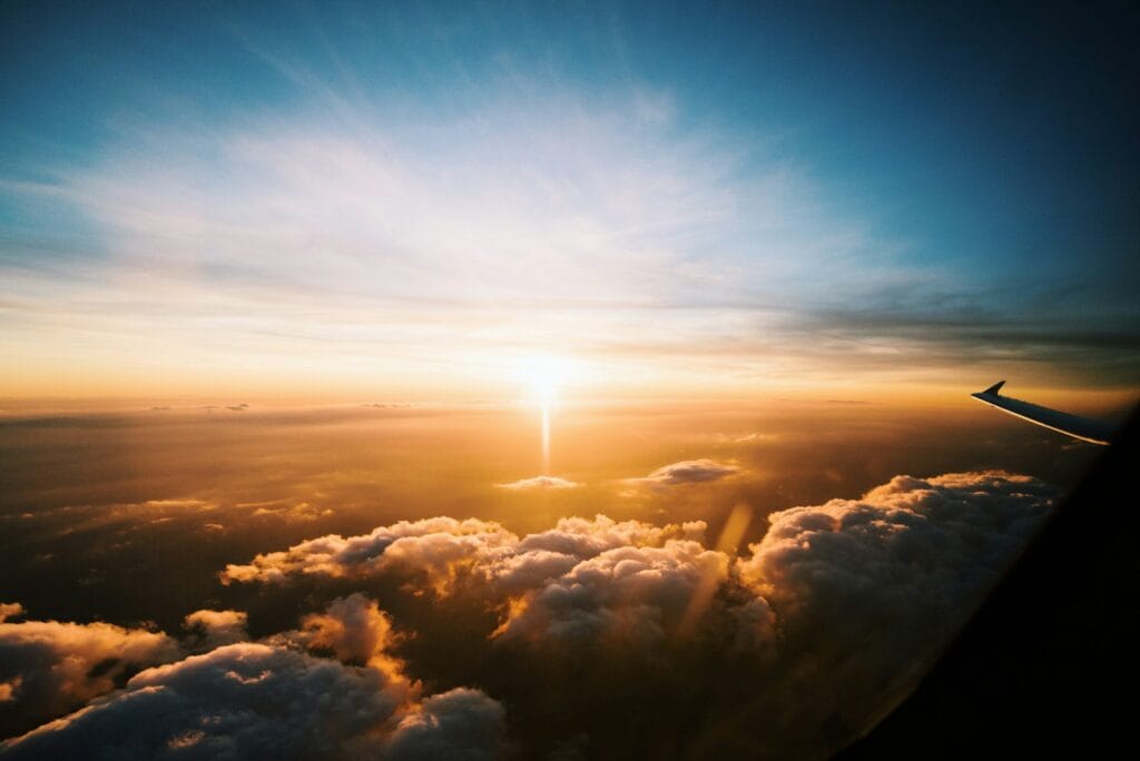 aerial view of sea of clouds during sunset