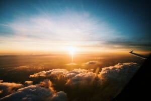 Blog aerial view of sea of clouds during sunset