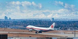 Blog white and red passenger plane on airport during daytime