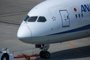Blog a large jetliner sitting on top of an airport tarmac