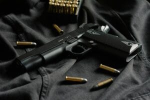 Blog black semi automatic pistol on black textile